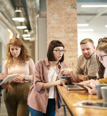 a group of people collaborating in an office